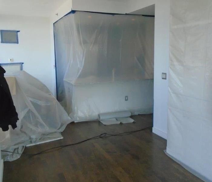 room with plastic containment setup during mold removal