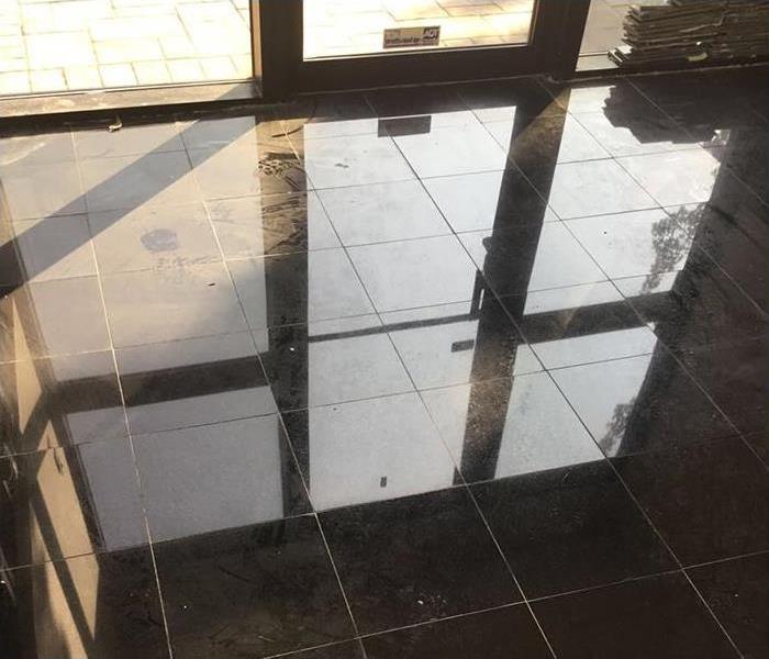 Flood damage to commercial lobby after frozen plumbing break