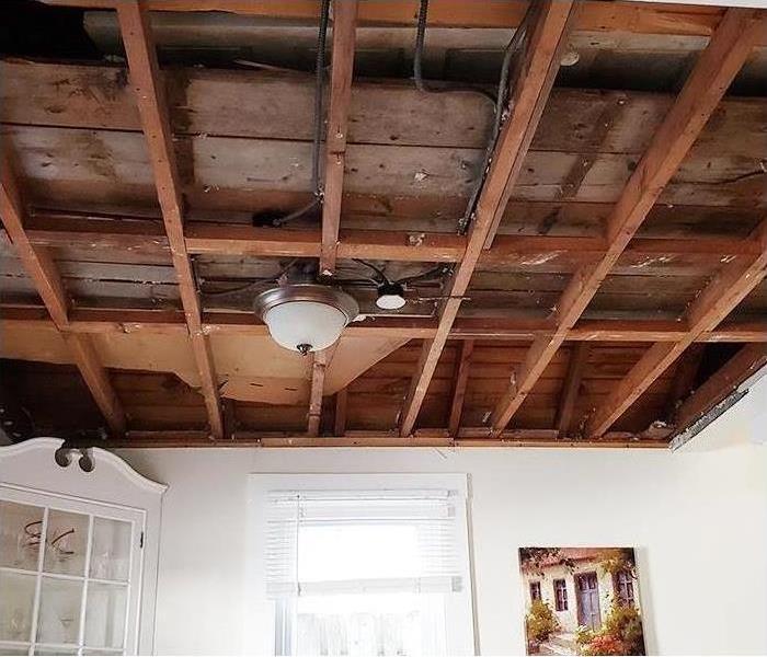 ceiling rafters after saturated drywall was removed during mitigation